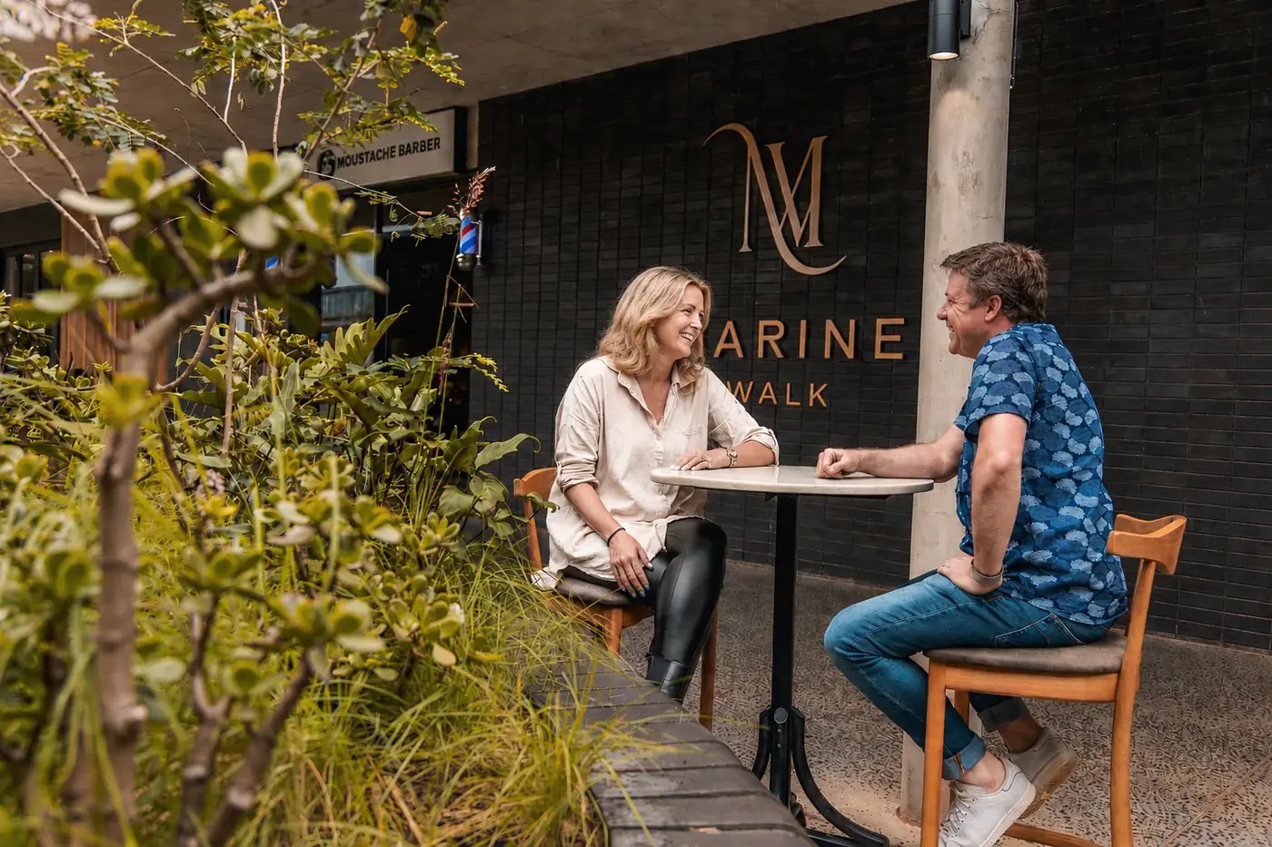 Couple at a caf&eacute; outside Marine Walk Shopping Centre